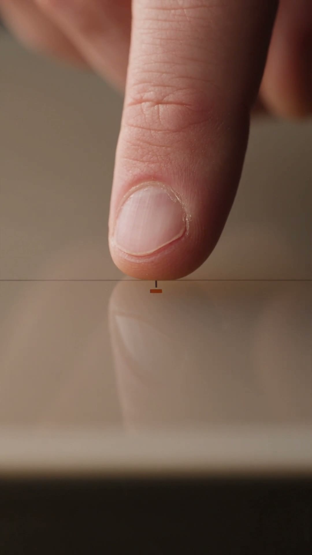 Vertical macro frame of two surfaces meeting, one giving way at the contact point