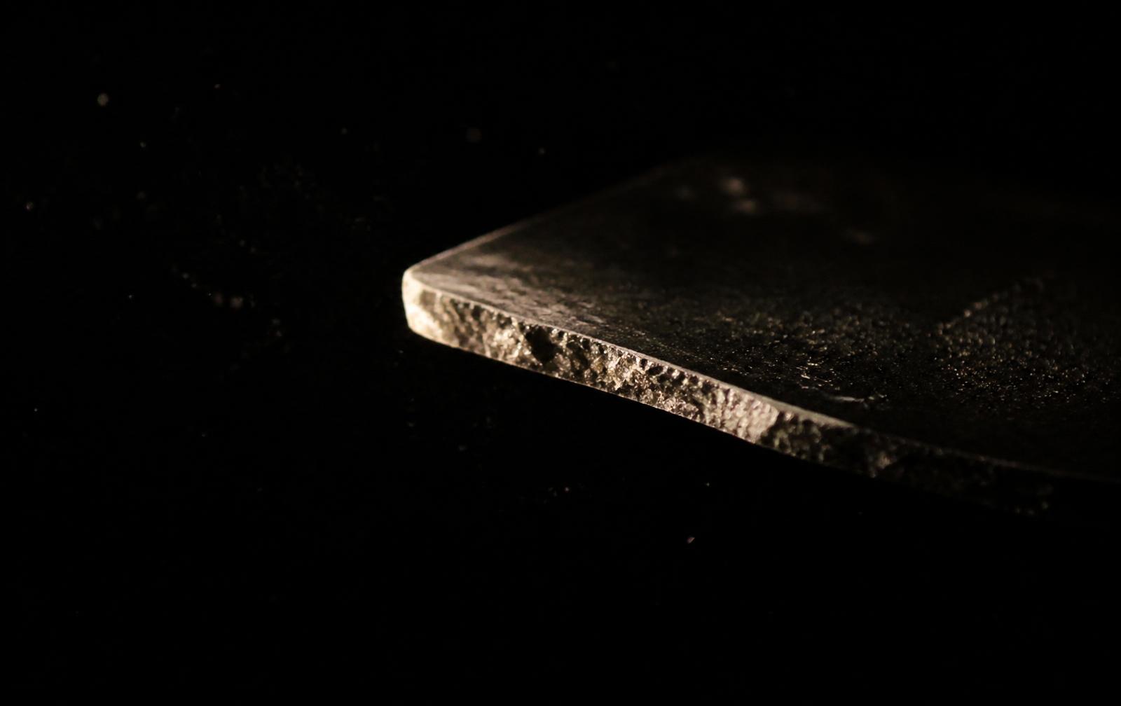 Second material detail — an object edge dissolving into shadow